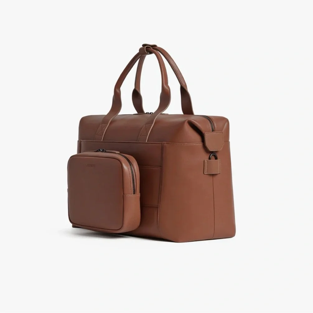 NWOT Monos Metro Duffel in color Mahogany